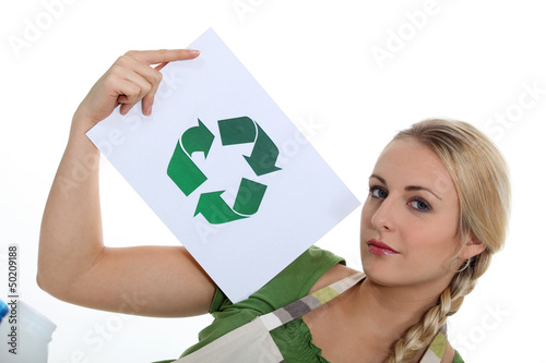 Photo: Woman holding recycle logo Woman holding recycle logo