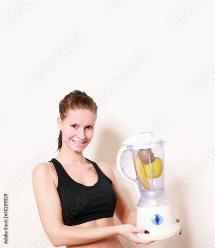 Photo: sportliche Frau mit Mixer sportliche Frau mit Mixer