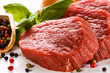 Raw beef and vegetables on white background