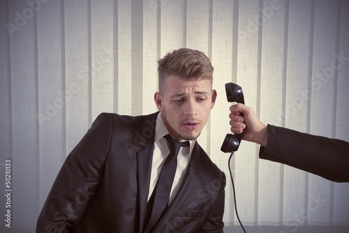 Photo: Businessman surprised by a call Businessman surprised by a call