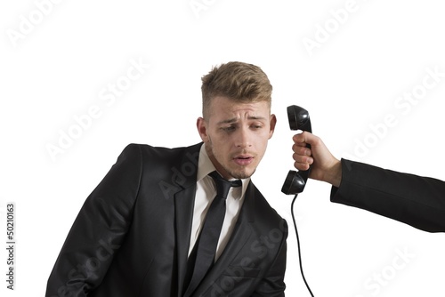 Photo: Businessman surprised by a call Businessman surprised by a call