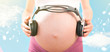 concept pregnancy and music. belly of pregnant woman andconcept