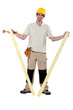 Worker holding two planks of wood