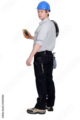 Photo: Qualified electrical engineer taking reading Qualified electrical engineer taking reading