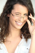 Brunette in glasses winking at the camera