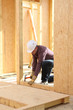Man hammering nail