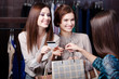 Pretty girlfriends pay with credit card