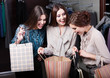 Two girls wonder the purchases of their girlfriend
