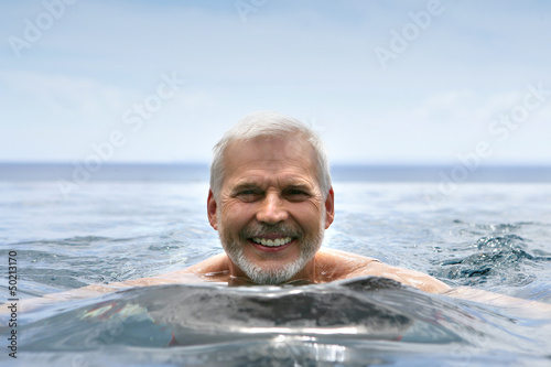 Photo: Elderly man swimming Elderly man swimming