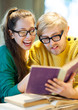 Students in cafe reading books