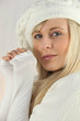 Pretty blonde in white wool cap and jumper
