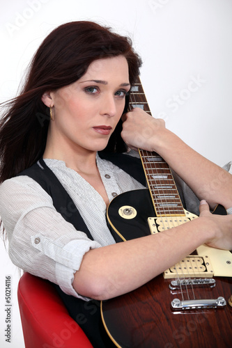 Photo: Woman with guitar Woman with guitar