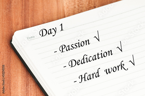 Photo: Diary page with text over a wooden background. Diary page with text over a wooden background.