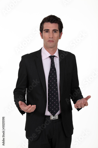 Photo: businessman looking lost and confused businessman looking lost and confused
