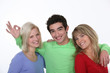 Man hugging two women
