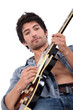 young man playing electrical guitar