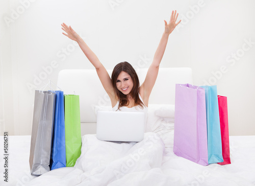 Photo: Young Woman Shopping Online Young Woman Shopping Online