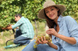 Man and woman working in vineyards