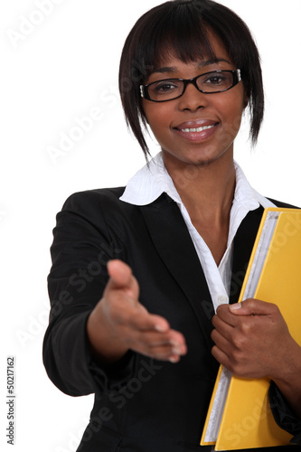 Photo: Working woman holding her hand out Working woman holding her hand out