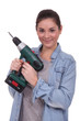 craftswoman holding a drill