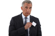 Executive pulling businesscard from pocket