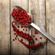 Pepper and grains on wooden background