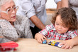 Grandmother and little boy playing