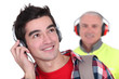 Young man's "earmuffs"