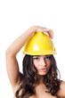 Young woman with hellow hard hat on white