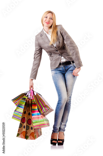 Photo: Attractive woman after christmas shopping on white Attractive woman after christmas shopping on white