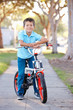 Photo: Boy Riding Bike On Path Boy Riding Bike On Path