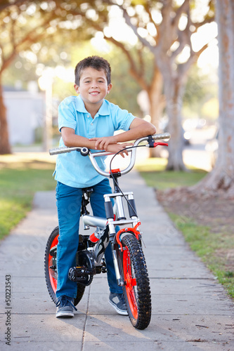 Photo: Boy Riding Bike On Path Boy Riding Bike On Path