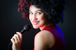 Female performer at disco with mic