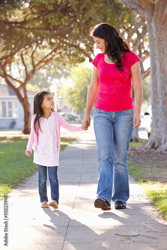 Photo: Mother And Daughter Walking Along Path Mother And Daughter Walking Along Path