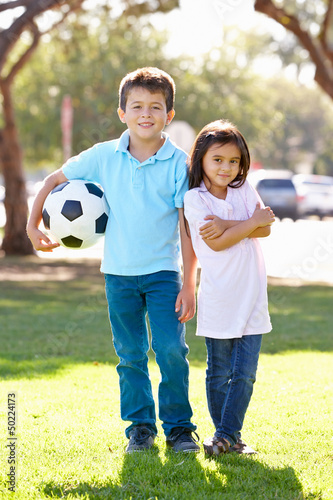 Photo: Two Children Playing Soccer Together Two Children Playing Soccer Together