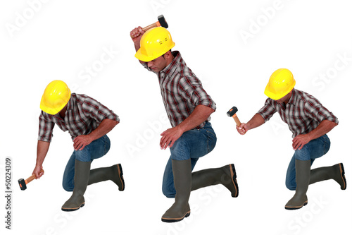 Photo: Tradesman using a hammer Tradesman using a hammer