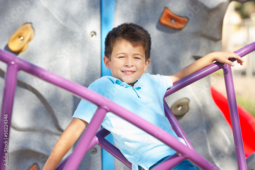 Photo: Boy On Climbing Frame In Park Boy On Climbing Frame In Park