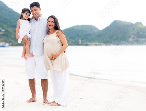 Photo: Beautiful family at the beach Beautiful family at the beach