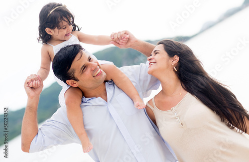Photo: Loving family at the beach Loving family at the beach