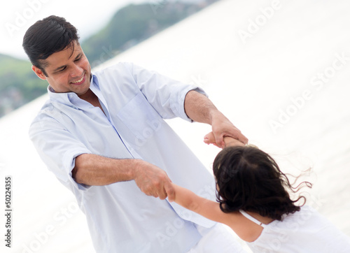 Photo: Father playing with his daughter Father playing with his daughter