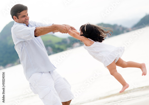 Photo: Dad playing with his daughter Dad playing with his daughter