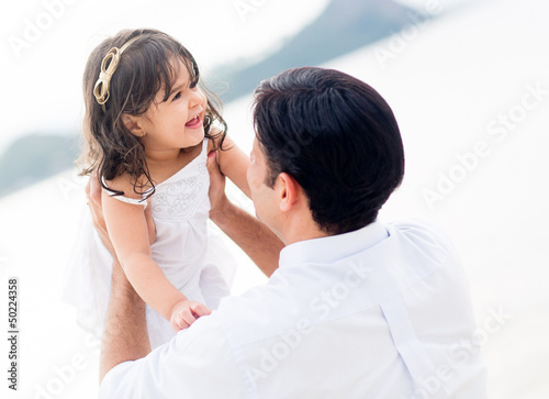 Photo: Father holding his little girl Father holding his little girl
