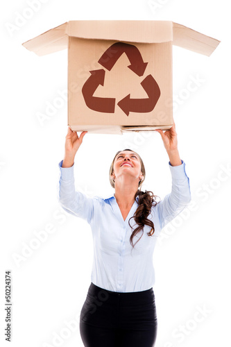 Photo: Woman lifting a recyclable box Woman lifting a recyclable box