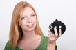 portrait of a young woman with money box