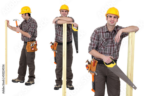 Photo: Carpenter standing with plank of wood and handsaw Carpenter standing with plank of wood and handsaw