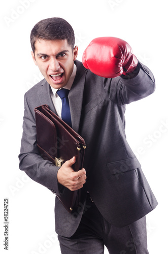 Photo: Young businessman with boxing gloves Young businessman with boxing gloves