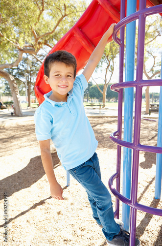 Photo: Boy On Climbing Frame In Park Boy On Climbing Frame In Park