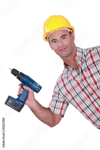 Photo: Handyman showing-off his new cordless drill Handyman showing-off his new cordless drill