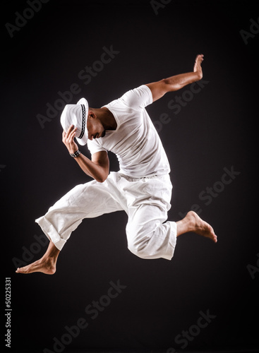 Photo: Dancer dancing dances in white clothing Dancer dancing dances in white clothing