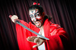 Man with sword and face mask
